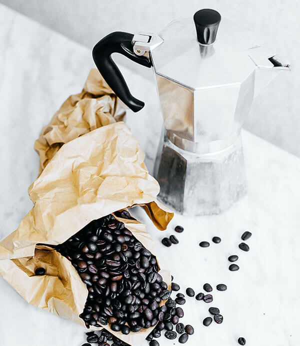 lack coffee beans and gray mocha pot