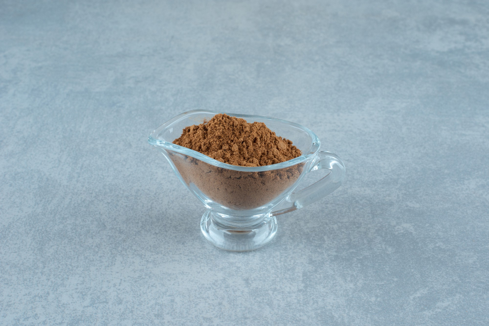 Guarana powder in a glass cup