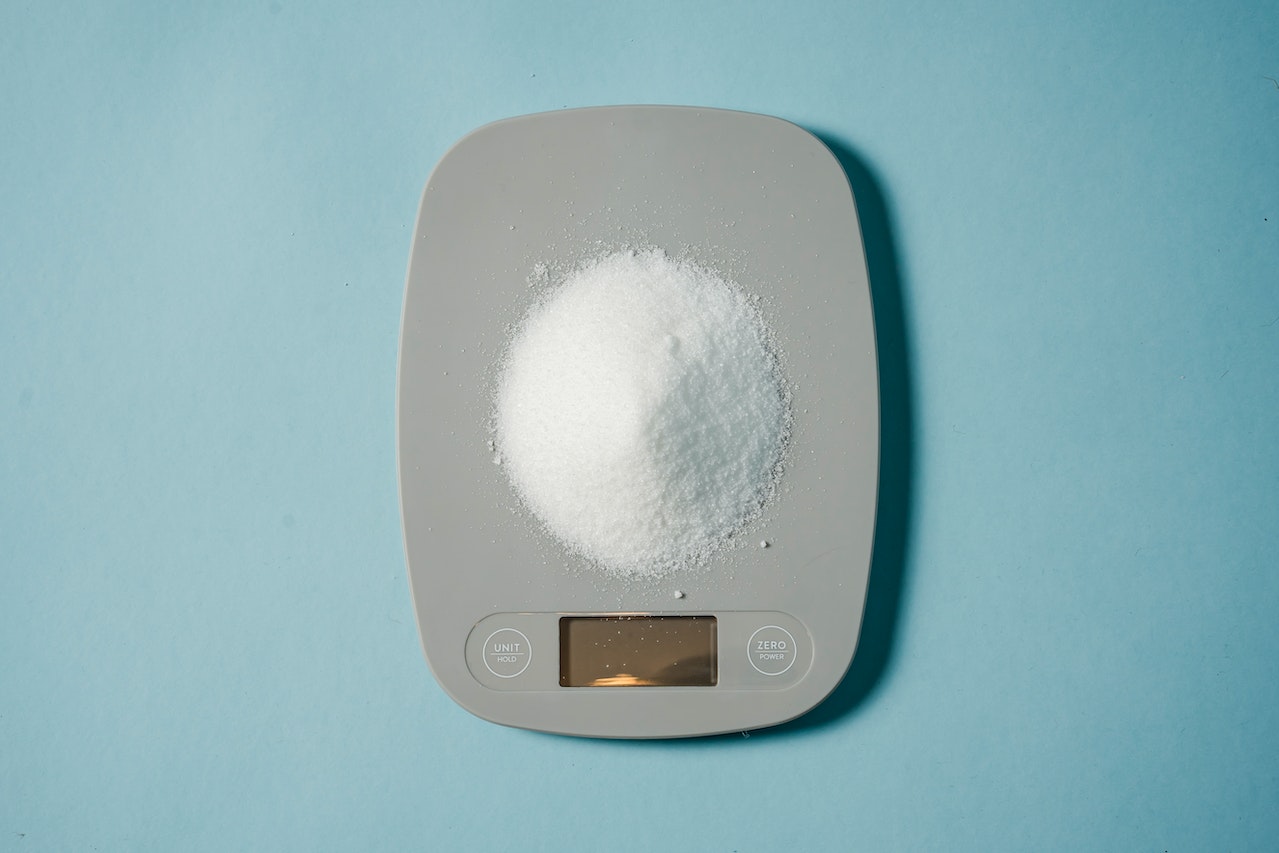 Electronic scales with a heap of sugar

